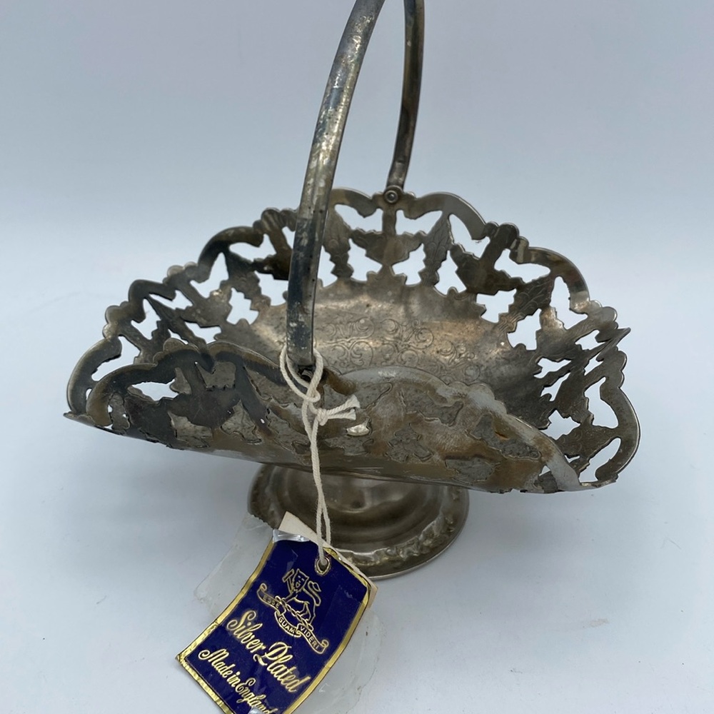 VTG Silver plated handled basket with engraving a
cut outs made in England 5.5”